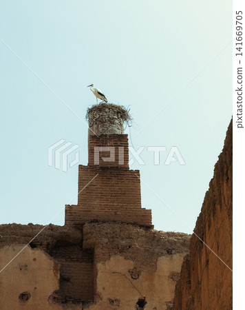 Stone minaret tower against clear sky Stone minaret tower against clear sky 141669705