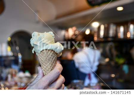 A moment to enjoy gelato at a cafe. A moment to enjoy gelato at a cafe. 141671145