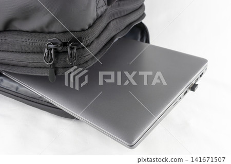 Image of taking a laptop out of a business backpack. Image of taking a laptop out of a business backpack. 141671507