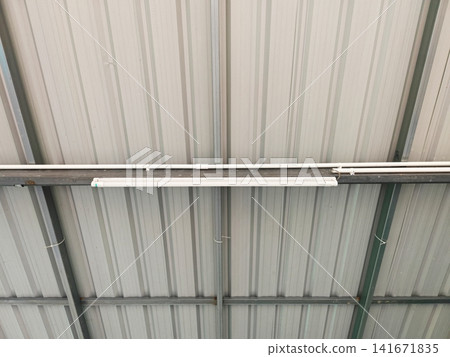 Industrial Metal Sheet Roof Structure with Steel Framework and LED Lighting Inside Factory 141671835