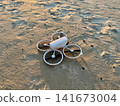 Drone on Sandy Beach Before Sunset Flight 141673004