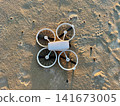 Drone on Sandy Beach Before Sunset Flight 141673005