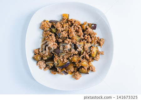 Stir-fried eggplant and ground meat with meat miso sauce - a sweet and savory home-style dish. Stir-fried eggplant and ground meat with meat miso sauce - a sweet and savory home-style dish. 141673325
