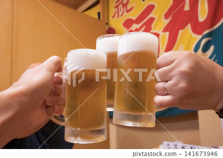 A scene of several people toasting with beer, an image of a drinking party. A scene of several people toasting with beer, an image of a drinking party. 141673946