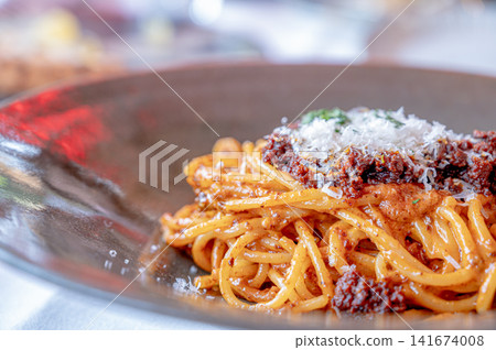 Pasta with meat sauce and Parmesan cheese – a classic Italian dish. Pasta with meat sauce and Parmesan cheese – a classic Italian dish. 141674008