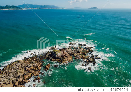 Coastline with ocean and waves in Brazil. Aerial view of Ponta das Campanhas Coastline with ocean and waves in Brazil. Aerial view of Ponta das Campanhas 141674924