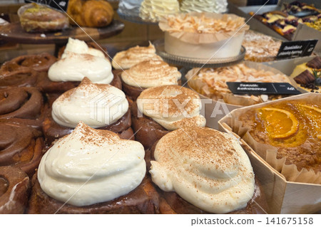 Assortment of Delicious Pastries and Cakes in a Bakery Display for Dessert Lovers Assortment of Delicious Pastries and Cakes in a Bakery Display for Dessert Lovers 141675158