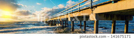 Pier and sea at sunset Pier and sea at sunset 141675171