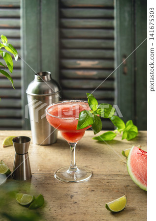 Watermelon Margarita cocktail spiced up with fresh basil Watermelon Margarita cocktail spiced up with fresh basil 141675303