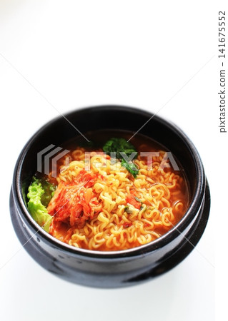 Kimchi ramen served in a tteokbokki (earthenware pot). Kimchi ramen served in a tteokbokki (earthenware pot). 141675552