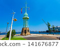 Kobe City, Hyogo Prefecture: The former Kobe Port signal station stands out against the bright blue summer sky. 141676877