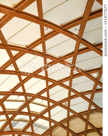 Architectural design featuring a wooden lattice-frame ceiling structure. Architectural design featuring a wooden lattice-frame ceiling structure. 141677877