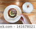 cheesecake or basque cheesecake , piece of cake or lemon cheesecake oe cheesecake with lemon topping 141678021