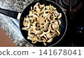 Sliced Button Mushrooms in Frying Pan Ready for Cooking, Top View 141678041
