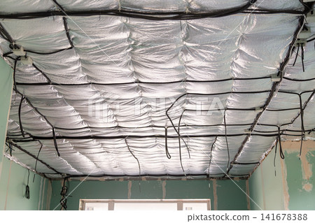 House renovation showing ceiling wiring and insulated roof structure House renovation showing ceiling wiring and insulated roof structure 141678388