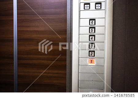 Elevator floor buttons, control panel with the 1st floor illuminated. Elevator floor buttons, control panel with the 1st floor illuminated. 141678585