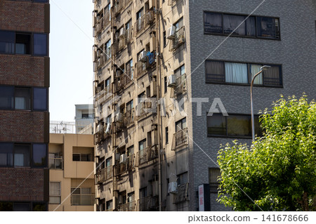 Exterior view of an old apartment building in the city Exterior view of an old apartment building in the city 141678666