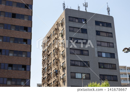 Exterior view of an old apartment building in the city Exterior view of an old apartment building in the city 141678667
