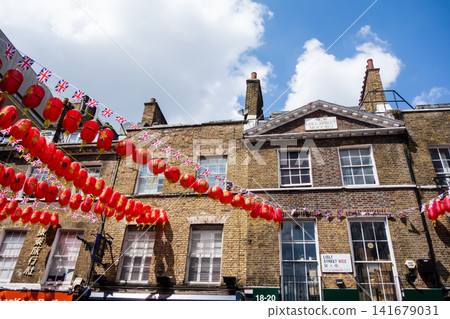 Many red lanterns decorated in London's Chinatown under a bright blue sky Many red lanterns decorated in London's Chinatown under a bright blue sky 141679031