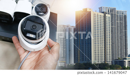 CCTV cameras and surveillance equipment in the area displaying images of high-rise buildings have space for text. CCTV cameras and surveillance equipment in the area displaying images of high-rise buildings have space for text. 141679047