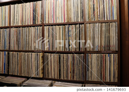 Vinyl Record Collection in Wooden Shelf Vinyl Record Collection in Wooden Shelf 141679693