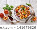 Italian peach salad with cheese, basil leaves 141679826
