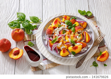 Italian peach salad with cheese, basil leaves Italian peach salad with cheese, basil leaves 141679826