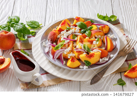 Fresh peach salad with cheese on a plate Fresh peach salad with cheese on a plate 141679827