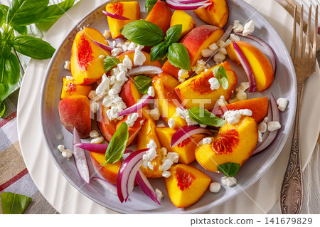 Fresh peach salad with cheese on a plate Fresh peach salad with cheese on a plate 141679829