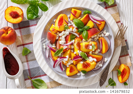 Italian peach salad with cheese, basil leaves Italian peach salad with cheese, basil leaves 141679832
