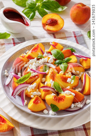 Summer fresh peach salad with red onion and cheese Summer fresh peach salad with red onion and cheese 141679835