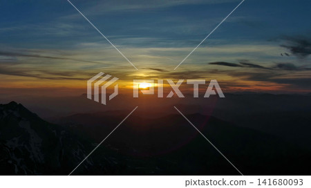 Rocky snow mountains at sunset aerial Rocky snow mountains at sunset aerial 141680093