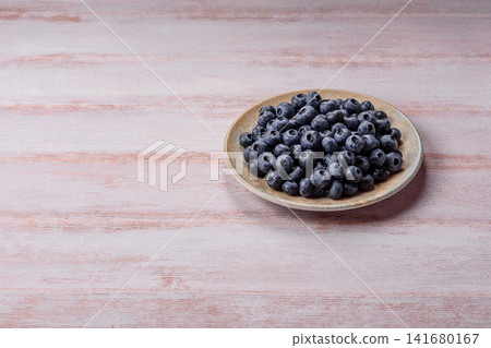 Fresh, ripe, and juicy wild blueberries as an ingredient for vegetarian dishes Fresh, ripe, and juicy wild blueberries as an ingredient for vegetarian dishes 141680167