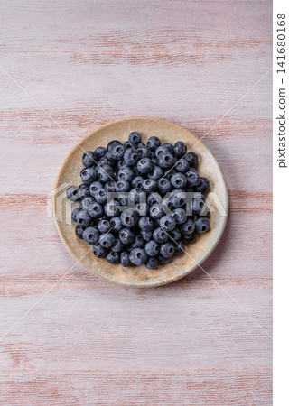 Fresh, ripe, and juicy wild blueberries as an ingredient for vegetarian dishes Fresh, ripe, and juicy wild blueberries as an ingredient for vegetarian dishes 141680168