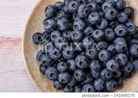 Fresh, ripe, and juicy wild blueberries as an ingredient for vegetarian dishes Fresh, ripe, and juicy wild blueberries as an ingredient for vegetarian dishes 141680170