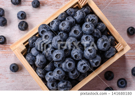 Fresh, ripe, and juicy wild blueberries as an ingredient for vegetarian dishes Fresh, ripe, and juicy wild blueberries as an ingredient for vegetarian dishes 141680180