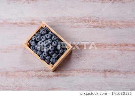 Fresh, ripe, and juicy wild blueberries as an ingredient for vegetarian dishes Fresh, ripe, and juicy wild blueberries as an ingredient for vegetarian dishes 141680185