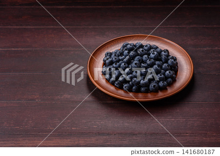 Fresh, ripe, and juicy wild blueberries as an ingredient for vegetarian dishes Fresh, ripe, and juicy wild blueberries as an ingredient for vegetarian dishes 141680187