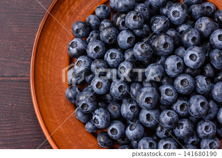 Fresh, ripe, and juicy wild blueberries as an ingredient for vegetarian dishes Fresh, ripe, and juicy wild blueberries as an ingredient for vegetarian dishes 141680190