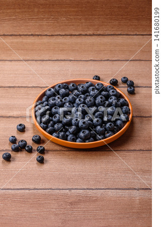 Fresh, ripe, and juicy wild blueberries as an ingredient for vegetarian dishes Fresh, ripe, and juicy wild blueberries as an ingredient for vegetarian dishes 141680199