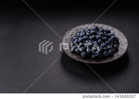 Fresh, ripe, and juicy wild blueberries as an ingredient for vegetarian dishes Fresh, ripe, and juicy wild blueberries as an ingredient for vegetarian dishes 141680207