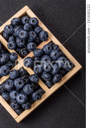 Fresh, ripe, and juicy wild blueberries as an ingredient for vegetarian dishes Fresh, ripe, and juicy wild blueberries as an ingredient for vegetarian dishes 141680222