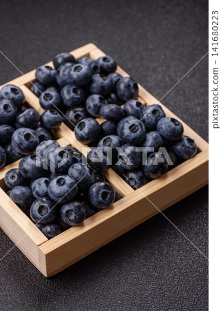 Fresh, ripe, and juicy wild blueberries as an ingredient for vegetarian dishes Fresh, ripe, and juicy wild blueberries as an ingredient for vegetarian dishes 141680223