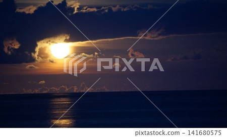 A soothing view of the full moon and the sea. A soothing view of the full moon and the sea. 141680575