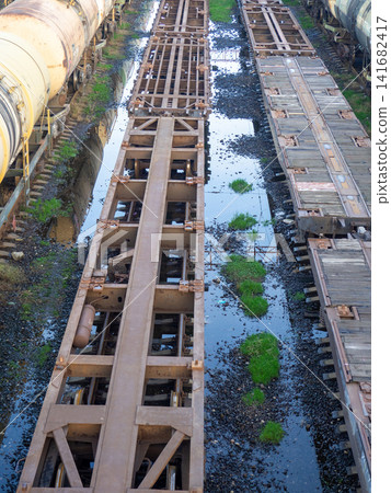 Empty freight train cars. Cars without a roof. Freight transportation. Freight train cars in the parking lot. Empty freight train cars. Cars without a roof. Freight transportation. Freight train cars in the parking lot. 141682417