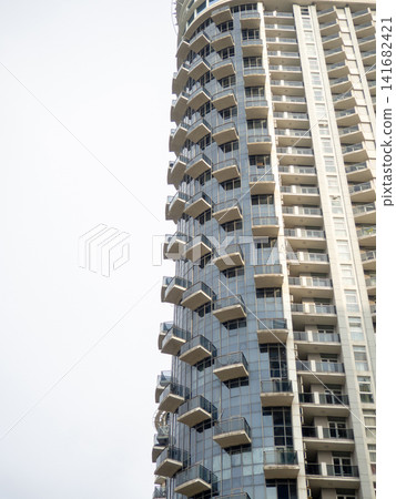 Modern urban infrastructure. Houses in Batumi. Tall buildings for residents. Abstraction. Asian architecture. Modern urban infrastructure. Houses in Batumi. Tall buildings for residents. Abstraction. Asian architecture. 141682421