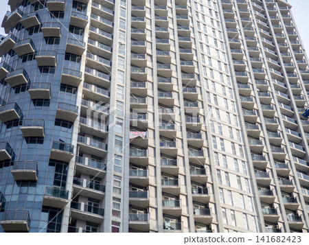 Modern urban infrastructure. Houses in Batumi. Tall buildings for residents. Abstraction. Asian architecture. Modern urban infrastructure. Houses in Batumi. Tall buildings for residents. Abstraction. Asian architecture. 141682423