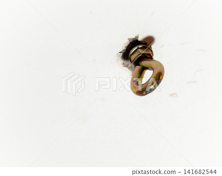 hammock hook on a white ceiling. Metal mount on the ceiling. Reliable fastening. hammock hook on a white ceiling. Metal mount on the ceiling. Reliable fastening. 141682544