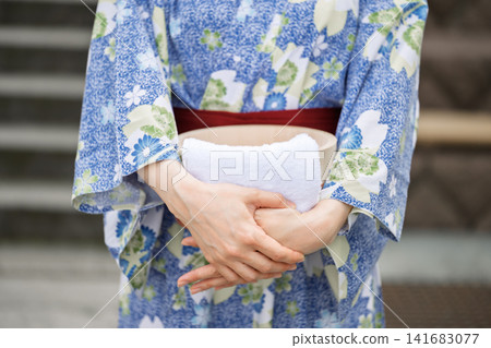 A woman in a yukata A woman in a yukata 141683077