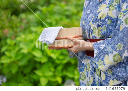 A woman in a yukata A woman in a yukata 141683079